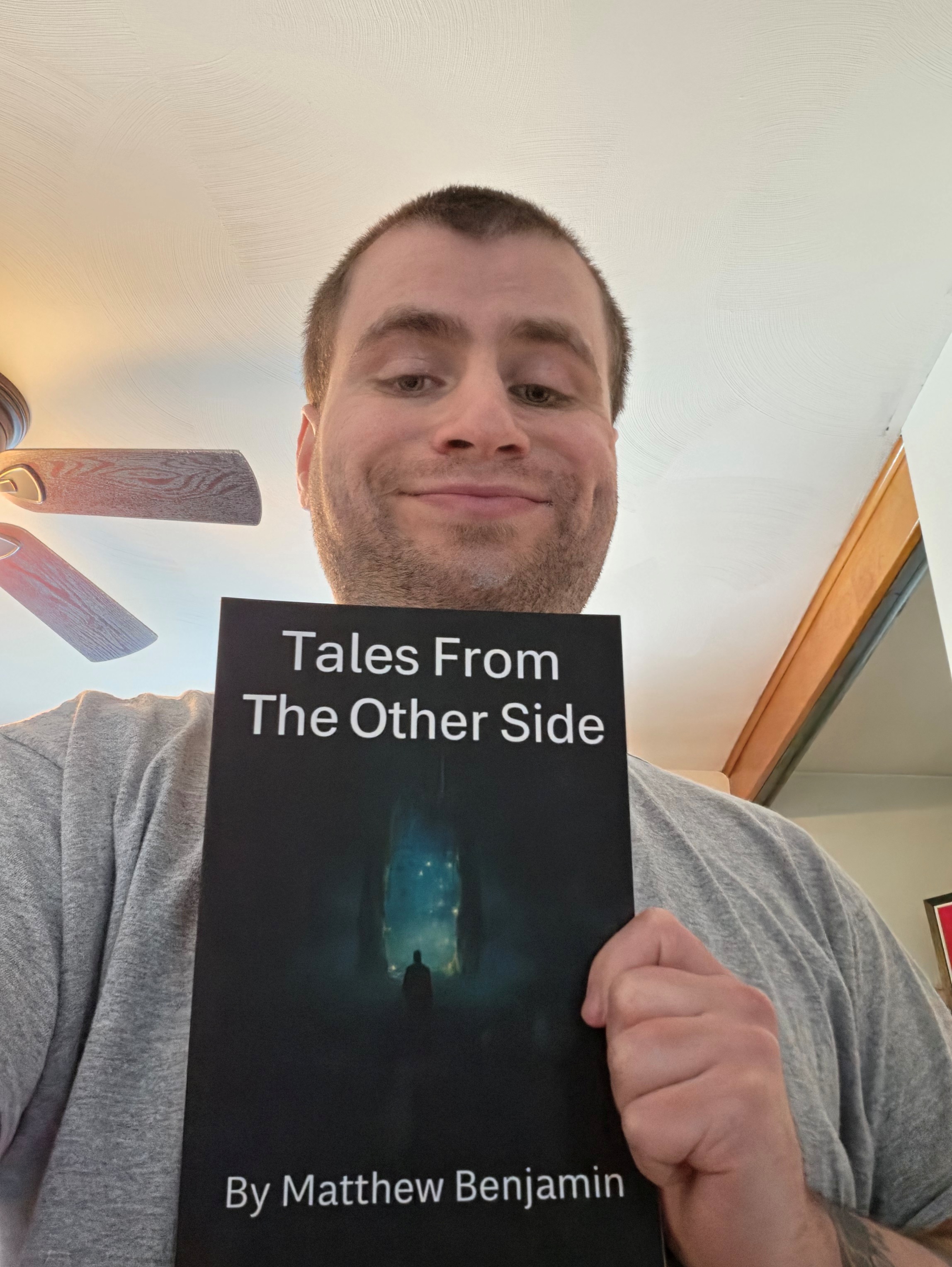 Matthew holding up his book